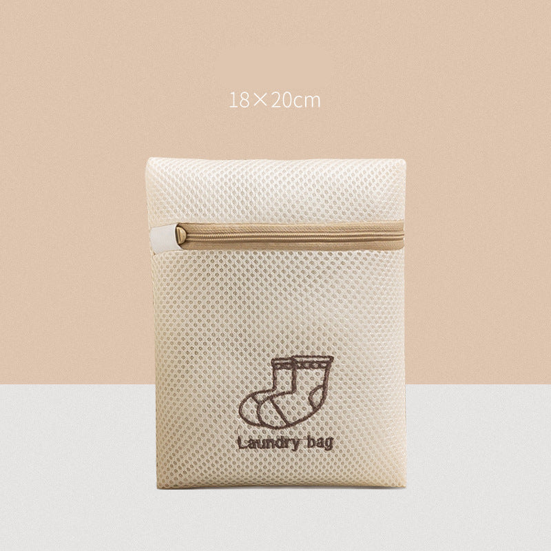 Beige laundry bag with mesh design and launcdry bag text on a beige background