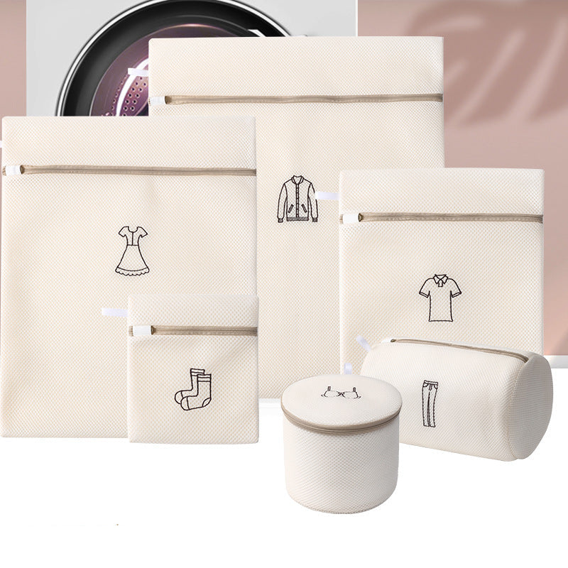 Set of beige laundry bags with icons and a cylindrical basket on a light pink background