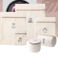 Set of beige laundry bags with icons and a cylindrical basket on a light pink background