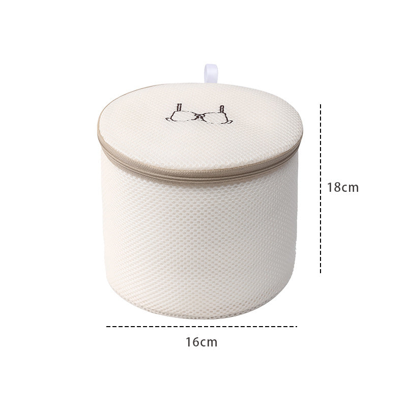 White woven basket with a lid, dimensions indicated on a white background