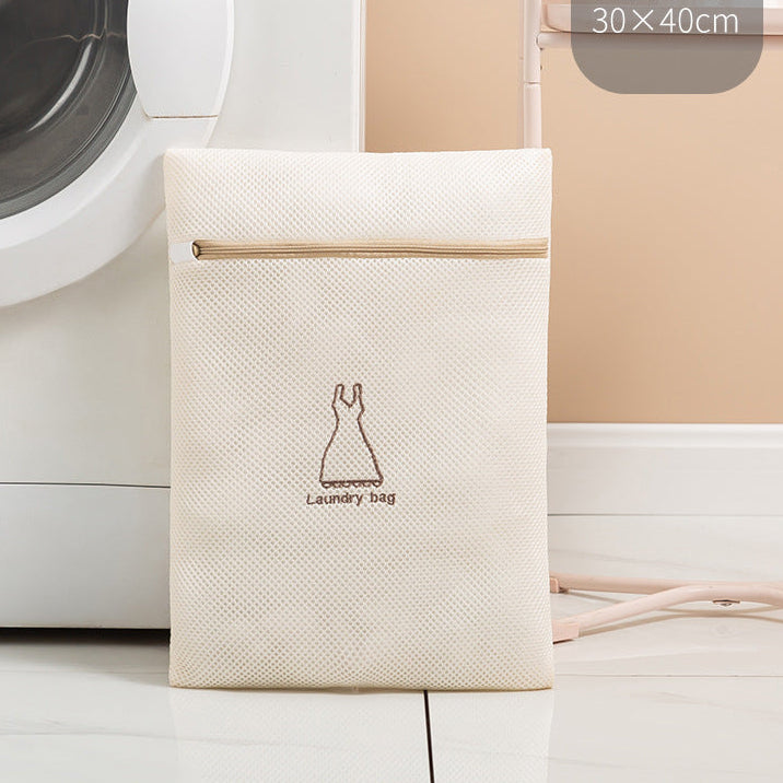 Beige laundry bag with a dress icon on a washing machine background