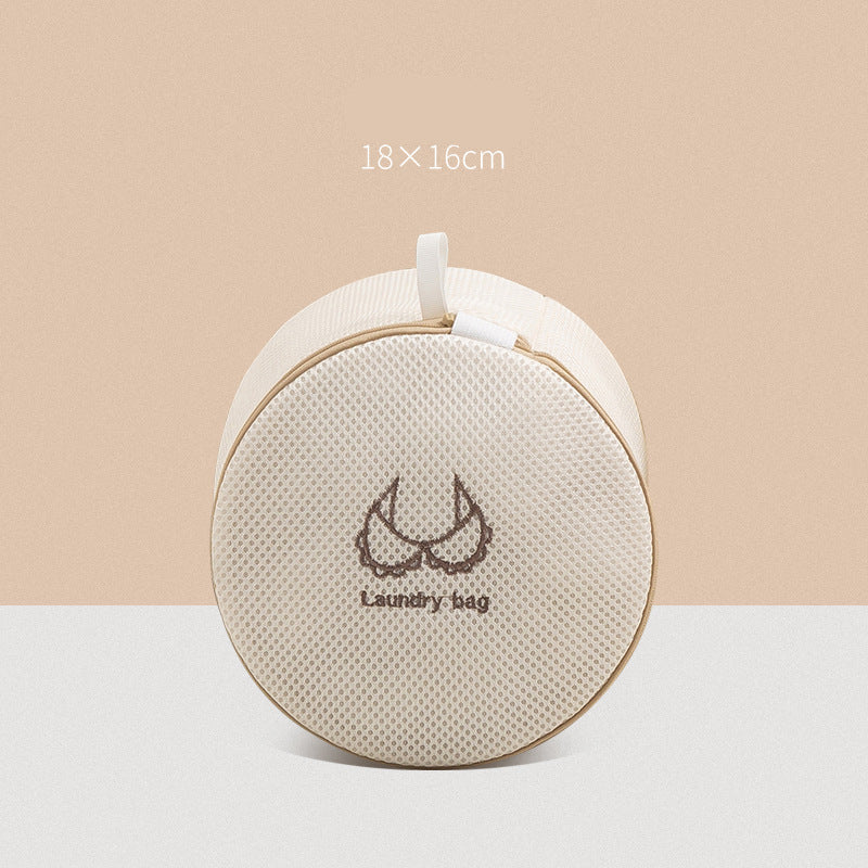 Round beige laundry bag with text on a beige background