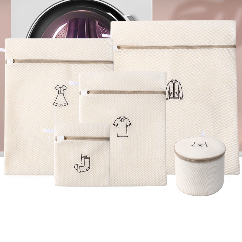 Set of beige laundry bags with icons and a white container on a light pink background.