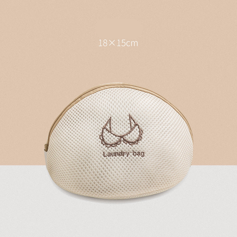 Round beige laundry bag with mesh design and 'Laundry bag' text on a beige background