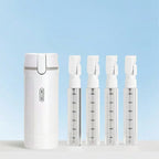 Set of white travel dispenser bottle with measurement markings on a light blue background