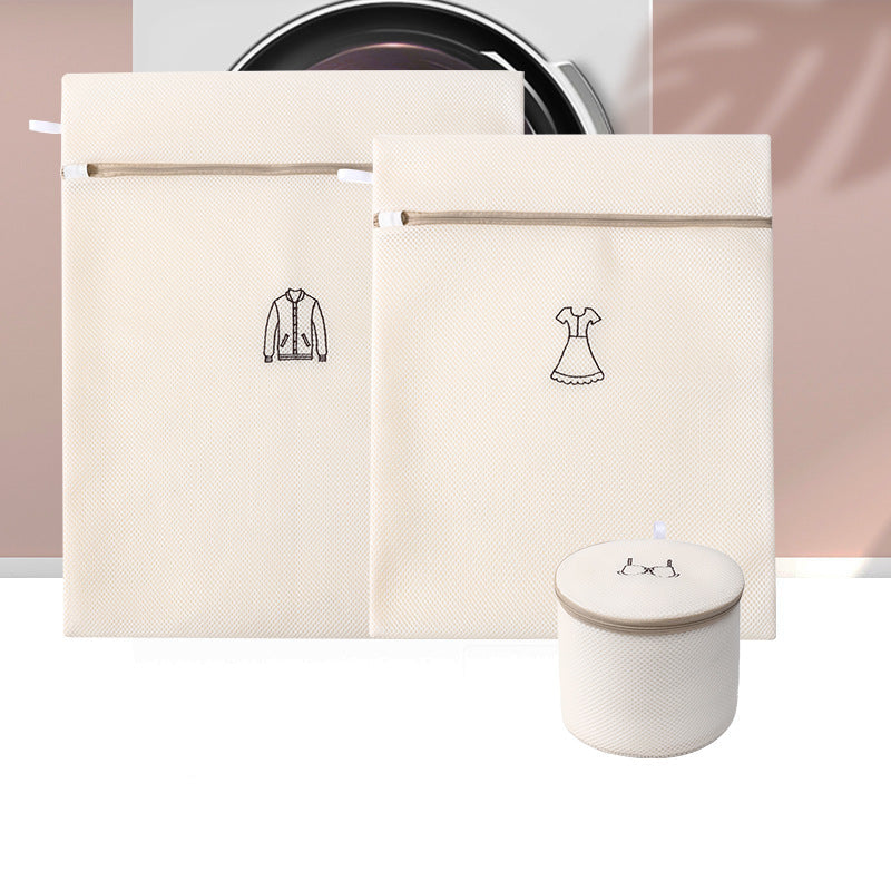Three beige bags with clothing icons and a small white container on a pink and white striped background.