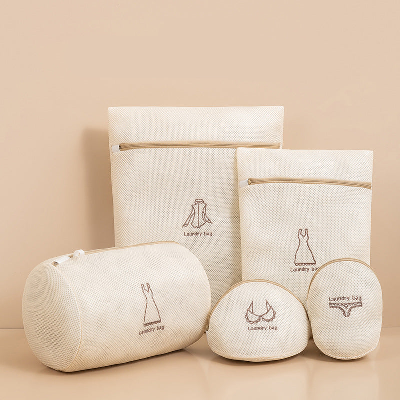 Set of beige laundry bags with a logo on a beige background